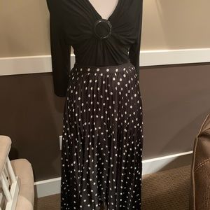 Satin, pleated, polka dot skirt.